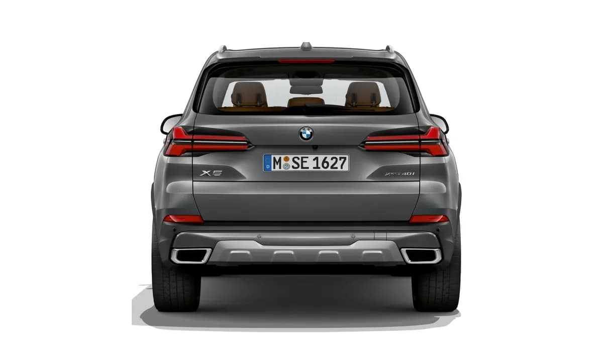 Rear view of the grey BMW X5 showing its LED tail lamps and twin exhaust trims