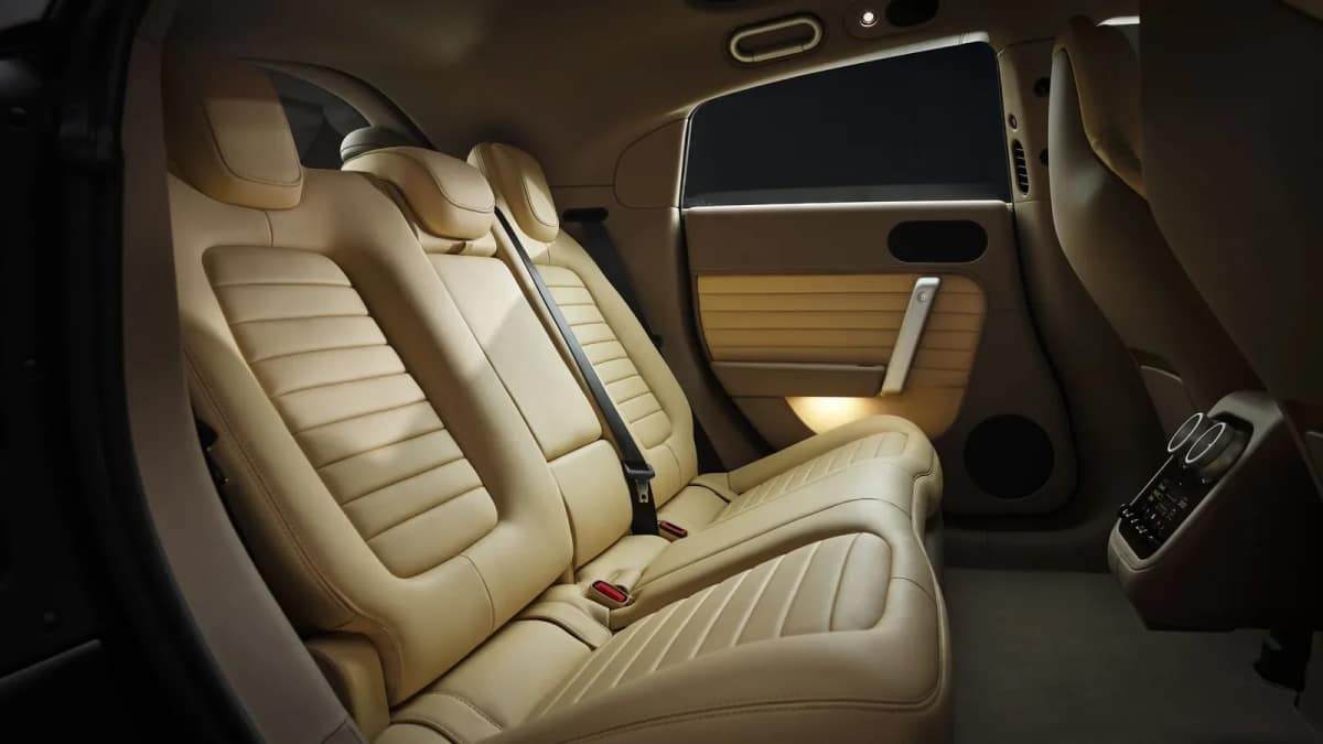 Beige leather rear seats of the Ferrari Luce with three seats and a rear-hinged door open