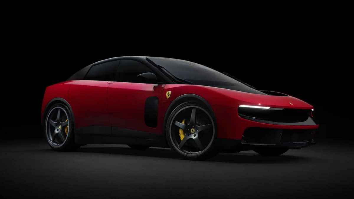 Red Ferrari Luce electric car with a black glass roof seen from the front three quarter angle