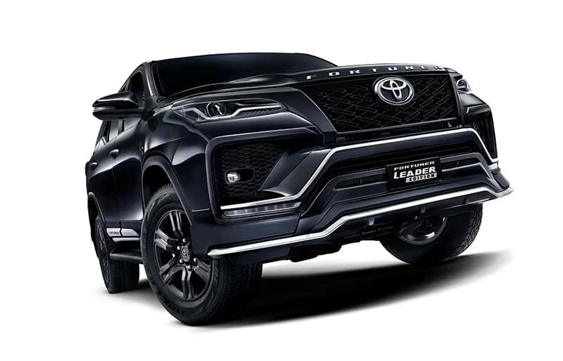 Black 2026 Toyota Fortuner Leader Edition front three-quarter view showing blacked-out grille, black alloy wheels and Leader Edition badge