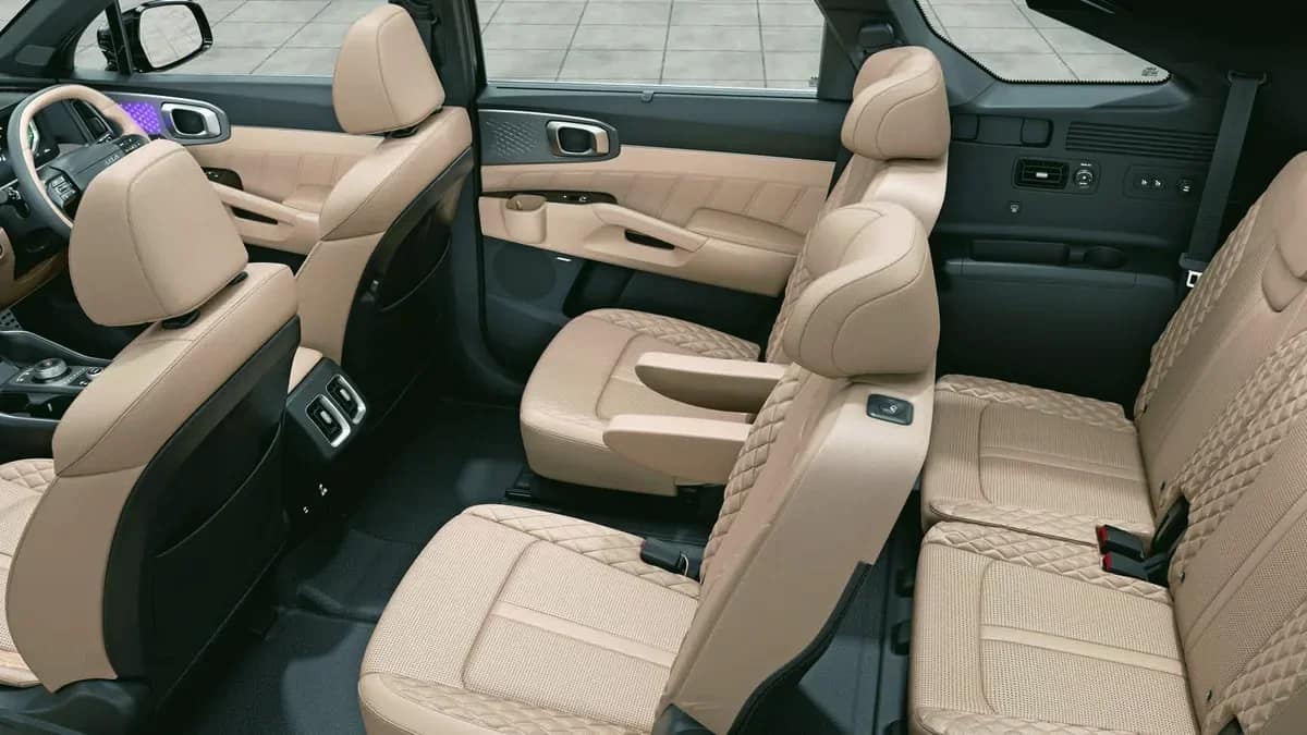 Kia Sorento cabin with beige seats, second-row captain chairs and a third-row bench