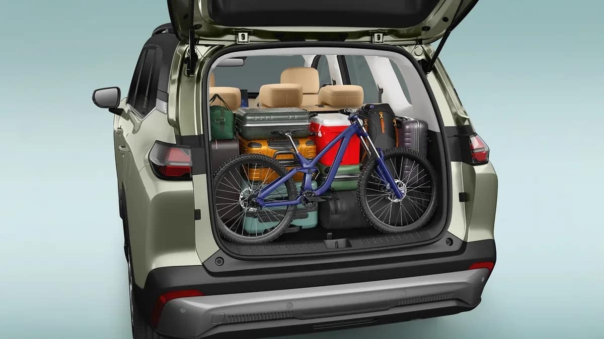Open boot of the MG Hector Tomahawk EV 7 seater with the third row folded and a bicycle and bags inside