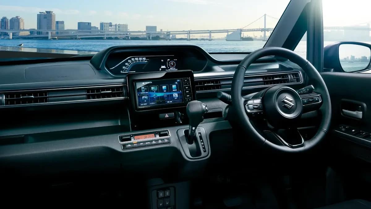 Dashboard of the Japanese Suzuki WagonR with a centre screen, steering wheel and CVT gear lever