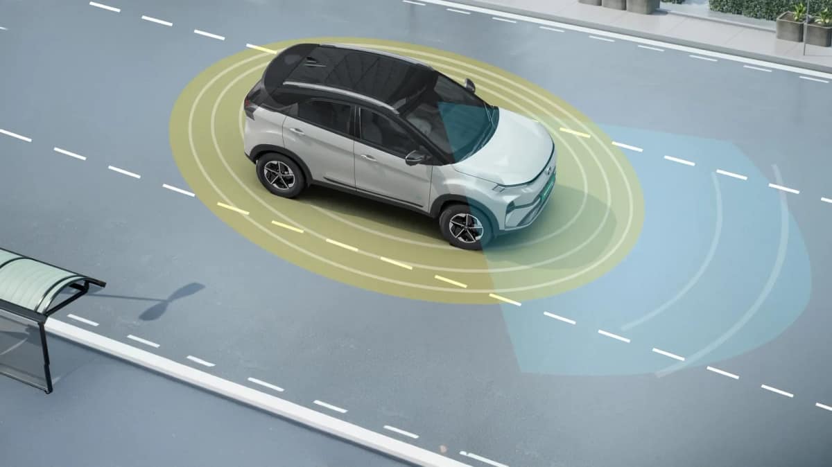 Tata Nexon.ev in white shown from above with ADAS sensing zones drawn around the car