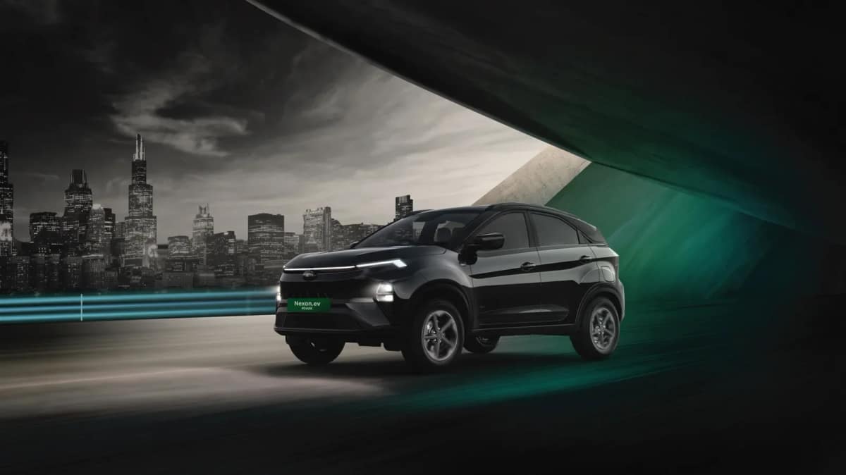 Current Tata Nexon.ev Dark edition in black showing its sloping roofline