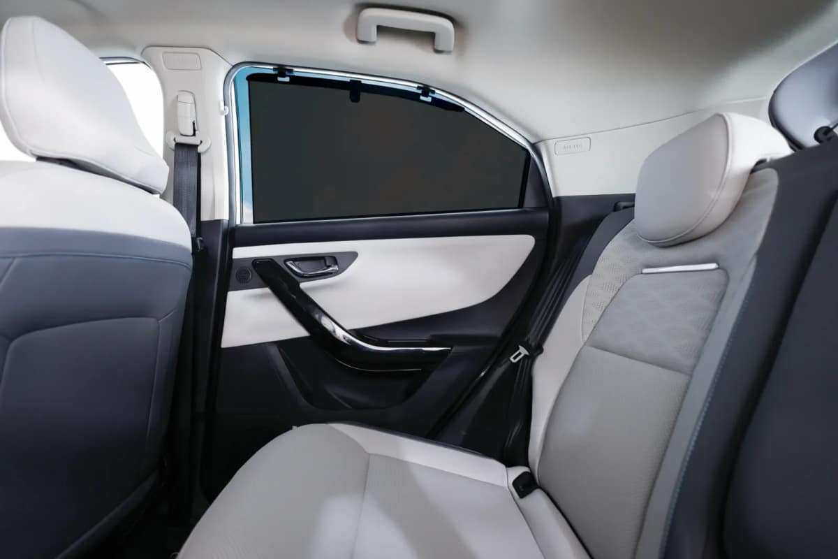 Rear seat of the Tata Nexon.ev with a sunshade on the rear window
