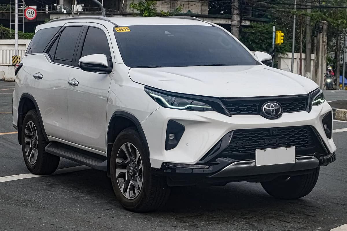 White Toyota Fortuner Legender 4x2 with split headlamps and two-tone styling, photographed outdoors