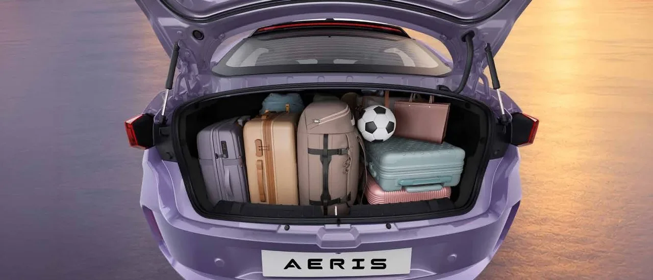 Tata Aeris boot loaded with suitcases and a football
